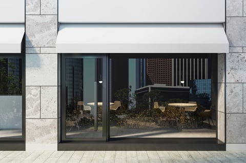 Empty modern shop exterior with large glass windows