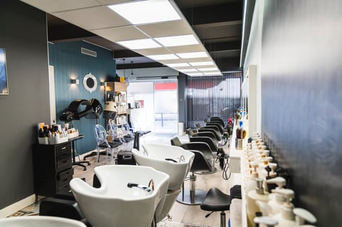 Empty modern hairdressing salon with styling chairs