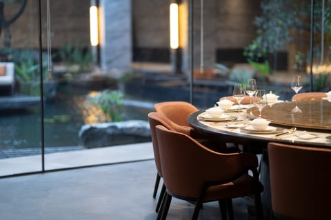 Elegant dining setup by garden view