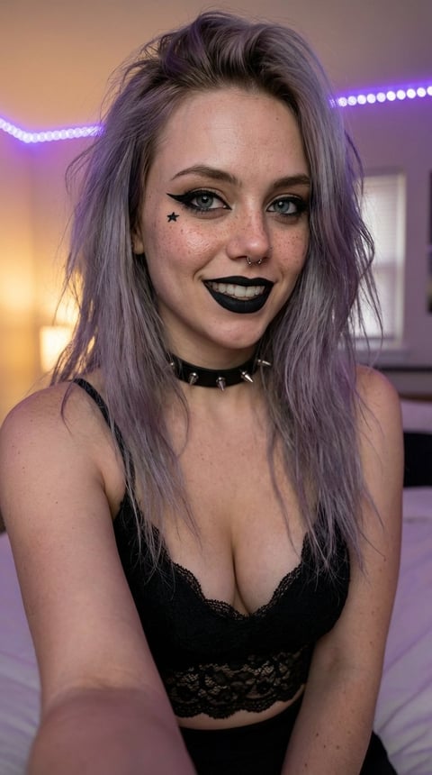 Woman with purple hair, black lipstick, star face tattoo, and choker necklace smiling at camera in neon-lit room